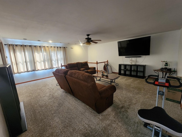 carpeted living room with ceiling fan