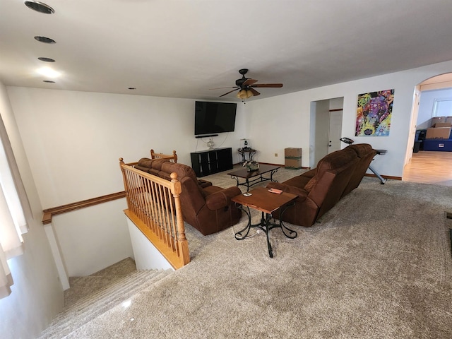 living room featuring light colored carpet and ceiling fan