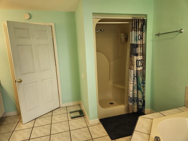 bathroom with tile patterned flooring and independent shower and bath