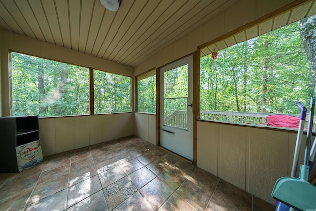 unfurnished sunroom with a healthy amount of sunlight