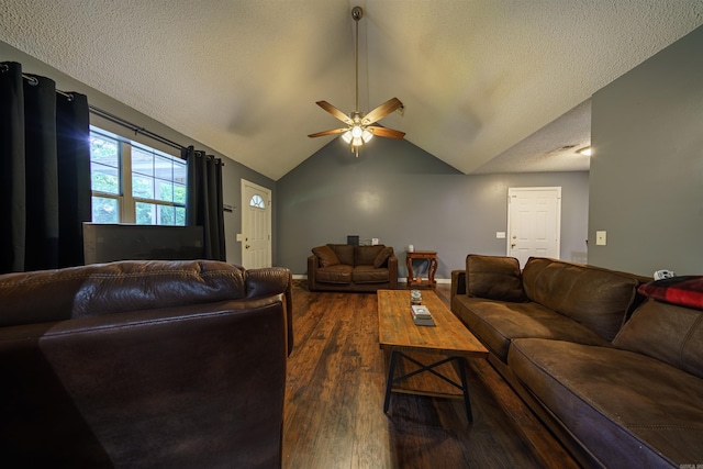 living room with dark wood-type flooring, a textured ceiling, vaulted ceiling, and ceiling fan