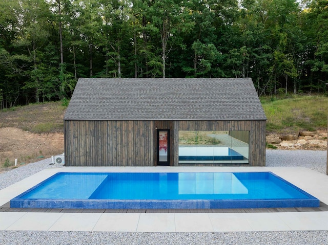 view of swimming pool featuring an outdoor structure