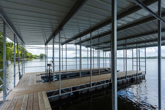 view of dock featuring a water view and boat lift