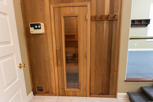 view of sauna featuring tile patterned flooring and baseboards