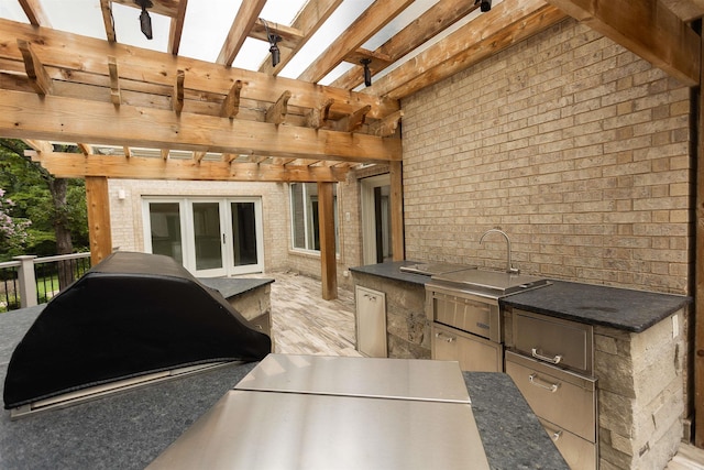 view of patio / terrace featuring a pergola and area for grilling