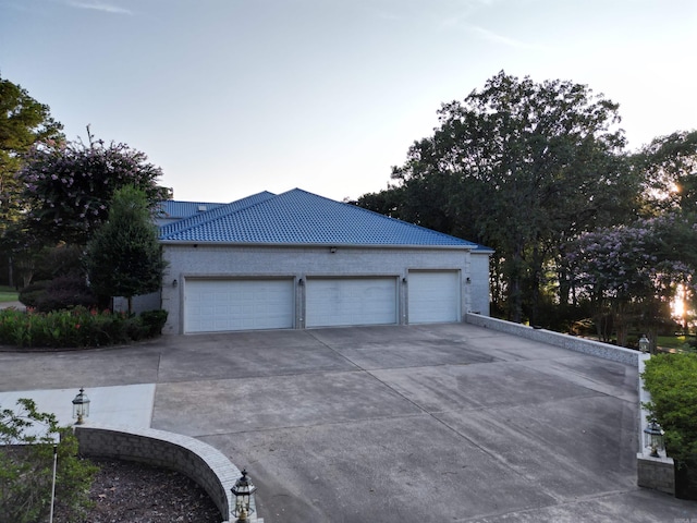 garage with concrete driveway