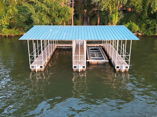 view of dock featuring a water view and boat lift