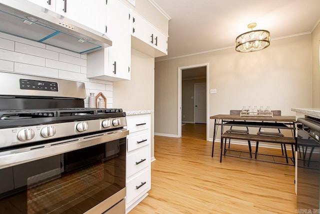 kitchen with crown molding, tasteful backsplash, white cabinets, light hardwood / wood-style floors, and stainless steel range with gas stovetop