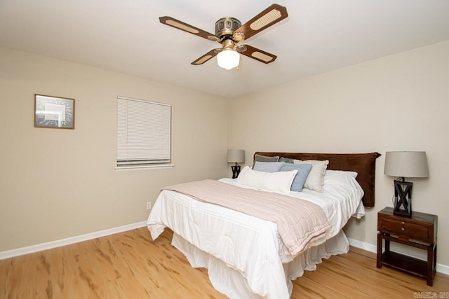 bedroom featuring light wood-type flooring and ceiling fan