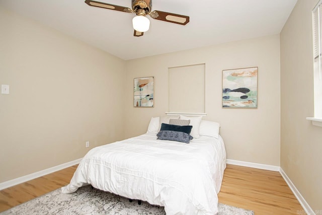 bedroom featuring light hardwood / wood-style flooring and ceiling fan