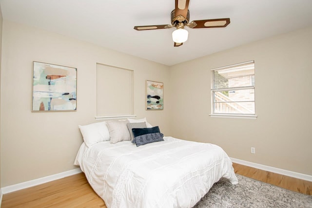 bedroom with light wood-type flooring and ceiling fan