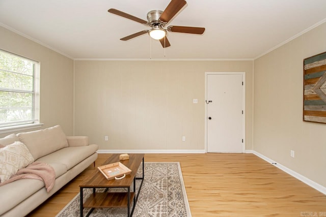 unfurnished living room featuring light wood-type flooring, ceiling fan, and ornamental molding