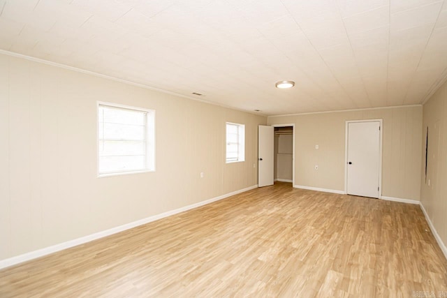 unfurnished bedroom with light hardwood / wood-style flooring and crown molding