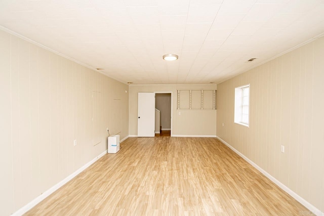 empty room with light hardwood / wood-style flooring