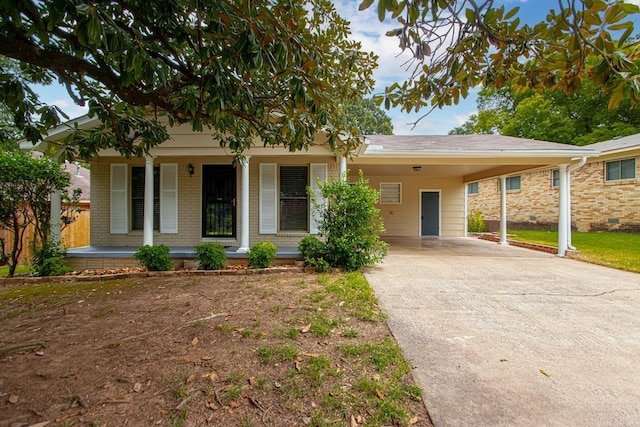 view of front of home featuring a carport and covered porch