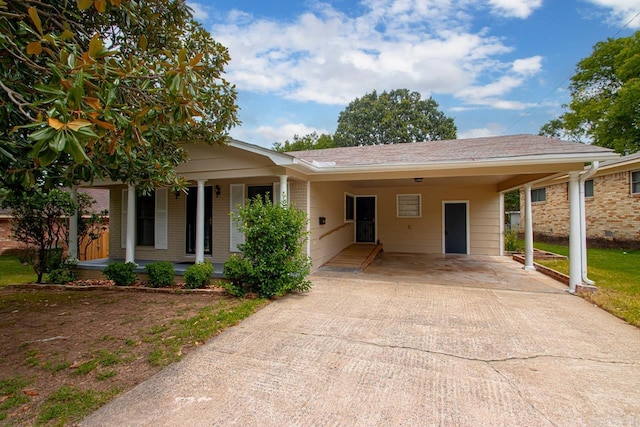 ranch-style home featuring a carport