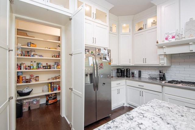 kitchen featuring appliances with stainless steel finishes, white cabinetry, and dark hardwood / wood-style floors