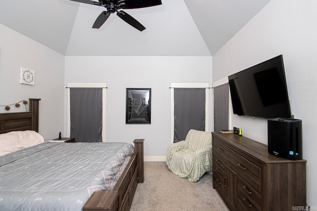 bedroom with light carpet, ceiling fan, and vaulted ceiling