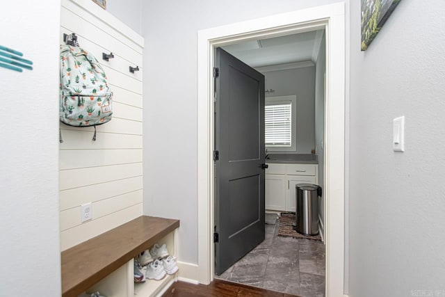 mudroom featuring crown molding and hardwood / wood-style floors