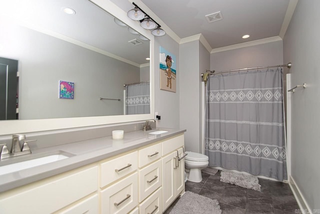 bathroom with tile patterned floors, crown molding, double vanity, and toilet