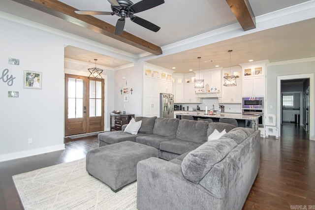 living room with beamed ceiling, ceiling fan, dark hardwood / wood-style floors, and crown molding