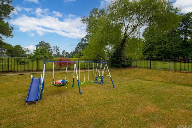 view of playground featuring a lawn