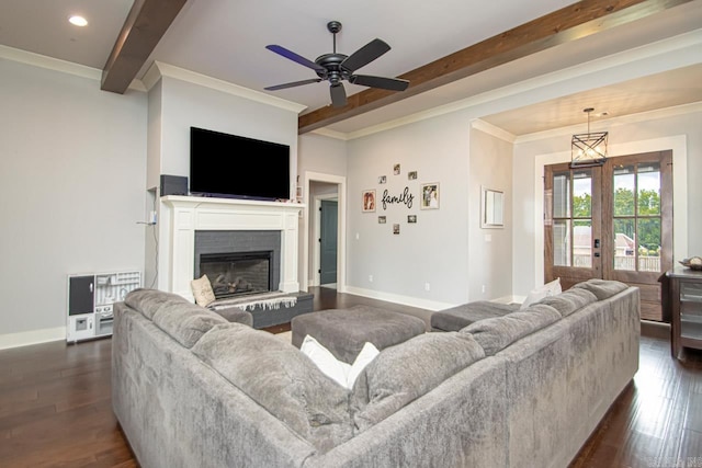 living room featuring dark hardwood / wood-style floors, beamed ceiling, crown molding, and ceiling fan