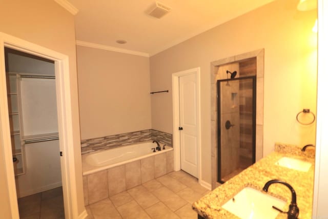 bathroom featuring tile patterned floors, ornamental molding, separate shower and tub, and double sink vanity