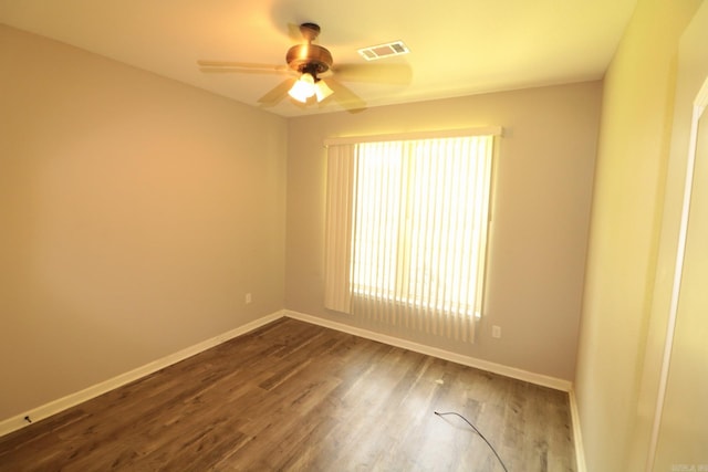 spare room with ceiling fan and hardwood / wood-style floors