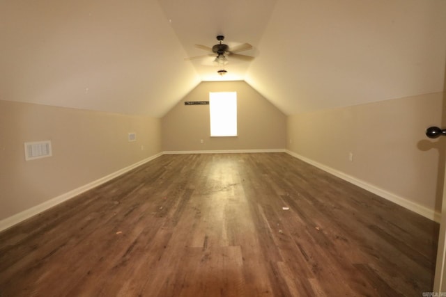 bonus room with dark hardwood / wood-style floors, vaulted ceiling, and ceiling fan