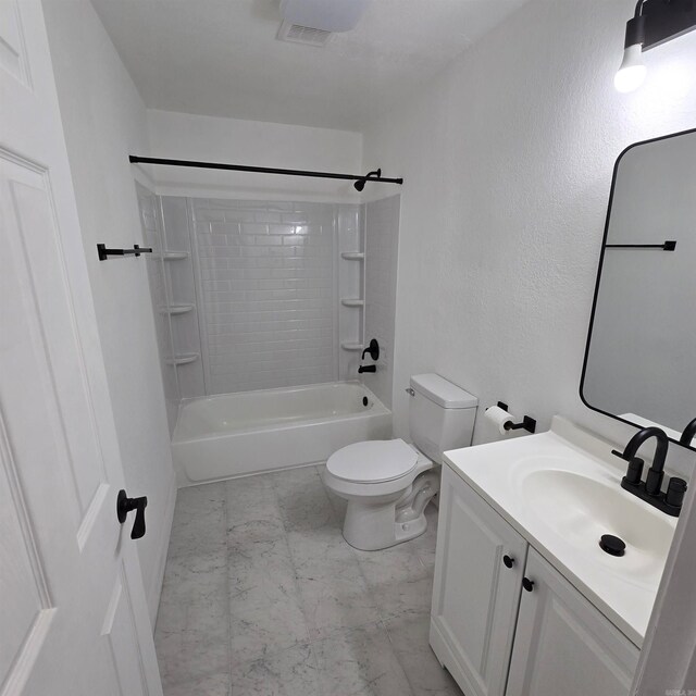 full bathroom featuring vanity, tiled shower / bath, toilet, and tile patterned floors