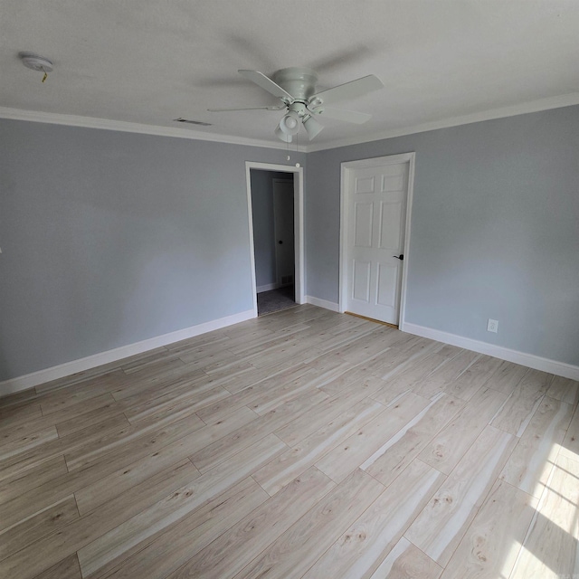 unfurnished bedroom with crown molding, light hardwood / wood-style flooring, and ceiling fan