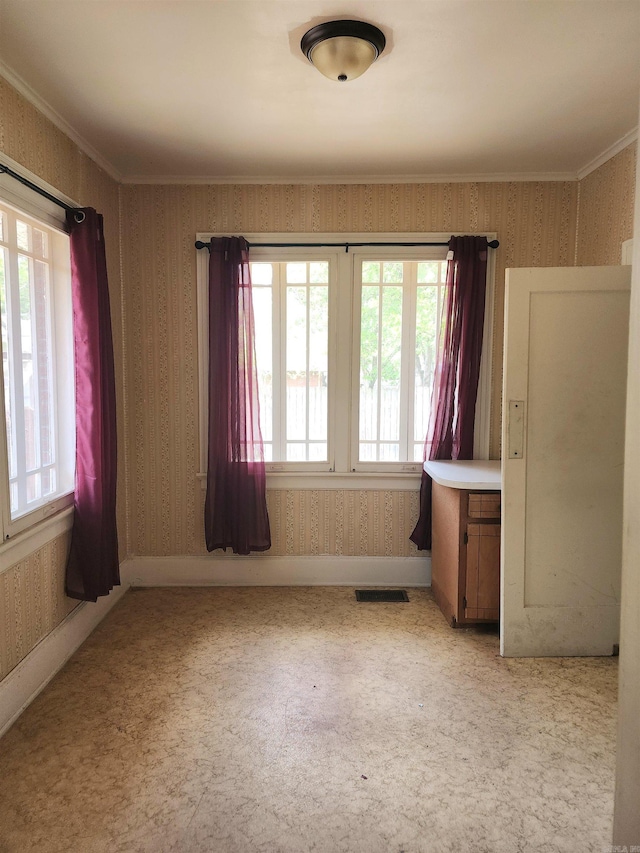 spare room with ornamental molding