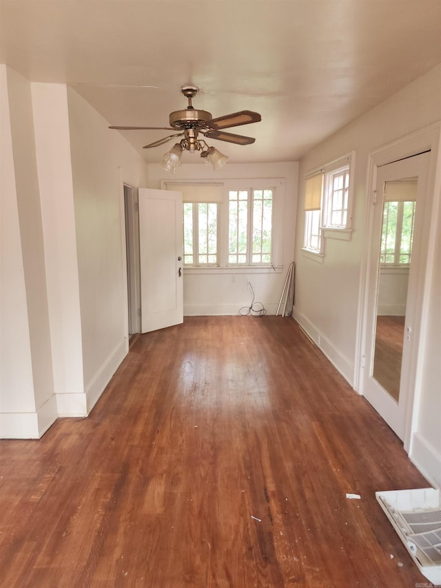 spare room with ceiling fan and wood-type flooring