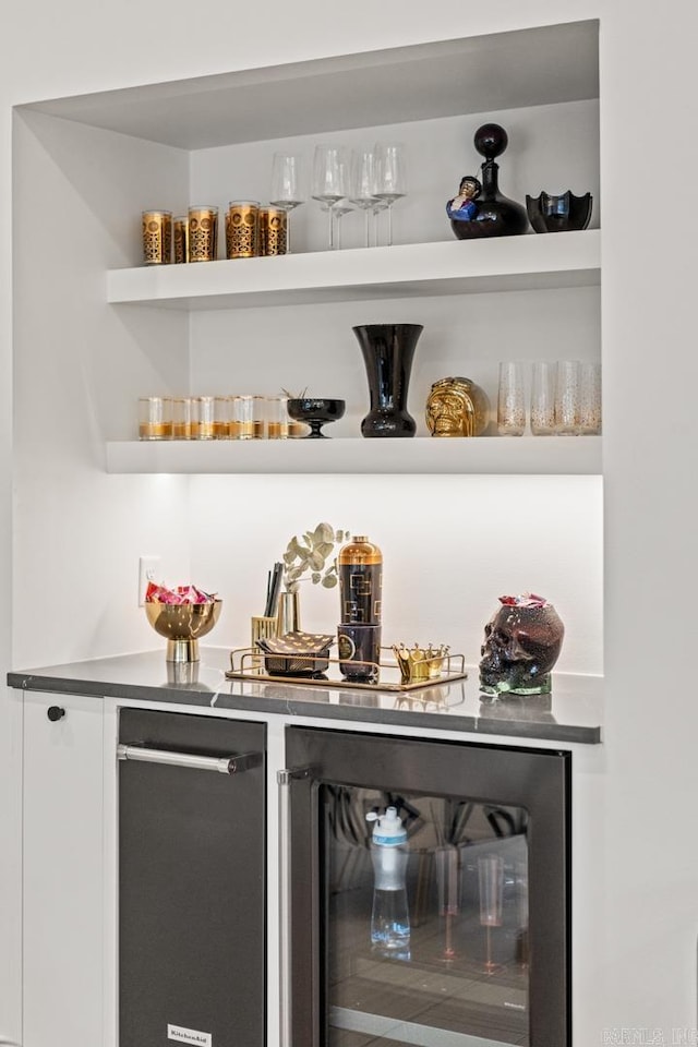 bar featuring stainless steel dishwasher