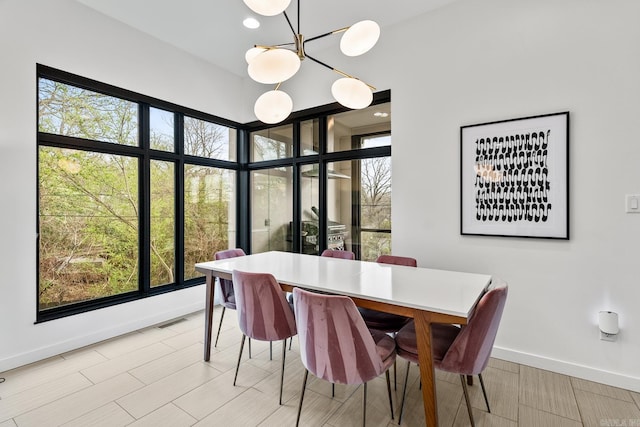 dining space featuring an inviting chandelier