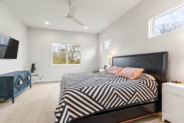 bedroom featuring multiple windows and ceiling fan