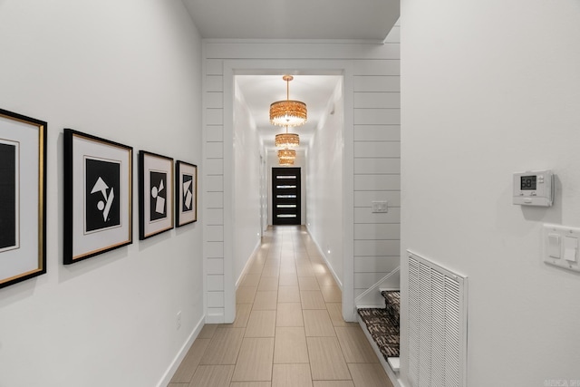 corridor featuring light tile patterned flooring