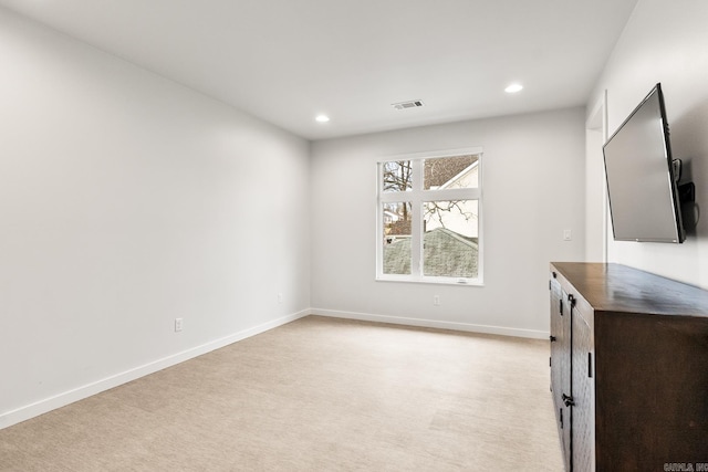 unfurnished bedroom with light carpet