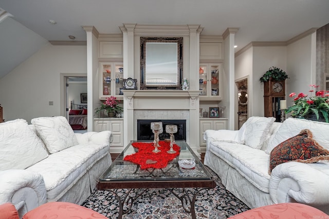 living room featuring a fireplace and ornamental molding