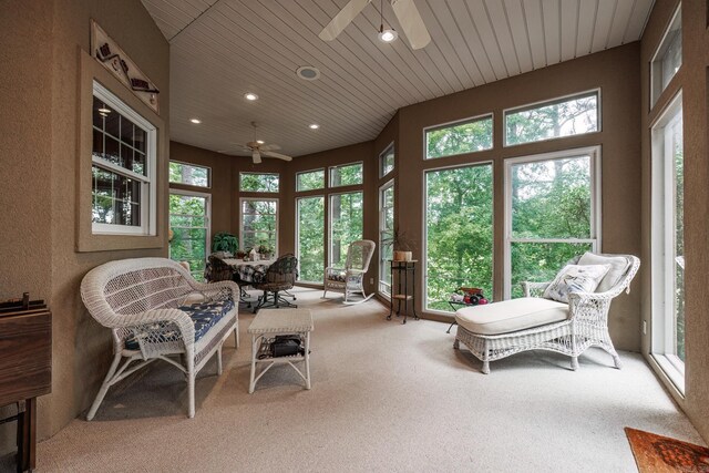 sunroom / solarium featuring wood ceiling and ceiling fan