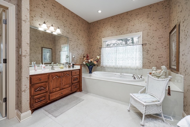 full bathroom with a wealth of natural light, wallpapered walls, vanity, and a garden tub