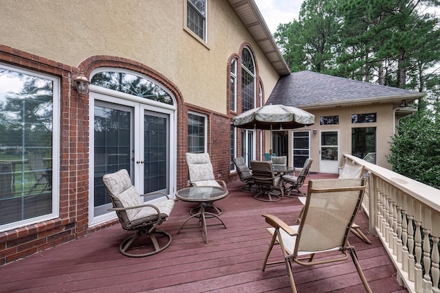 deck featuring french doors and outdoor dining area