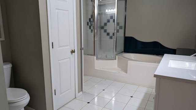 full bathroom featuring vanity, tile patterned floors, shower with separate bathtub, and toilet