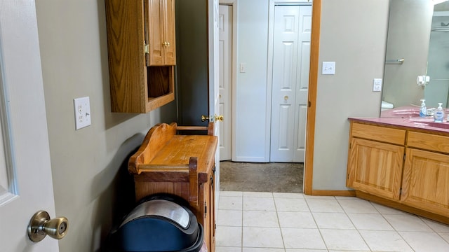 bathroom with vanity and tile patterned flooring