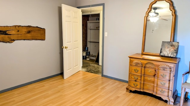 bedroom featuring ceiling fan and light hardwood / wood-style floors