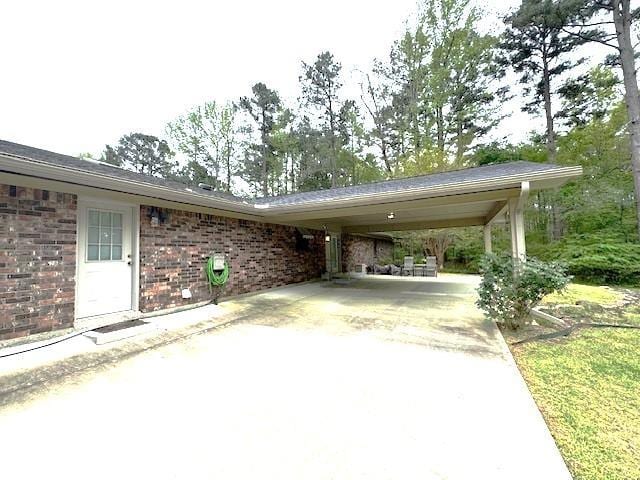 view of vehicle parking featuring a carport