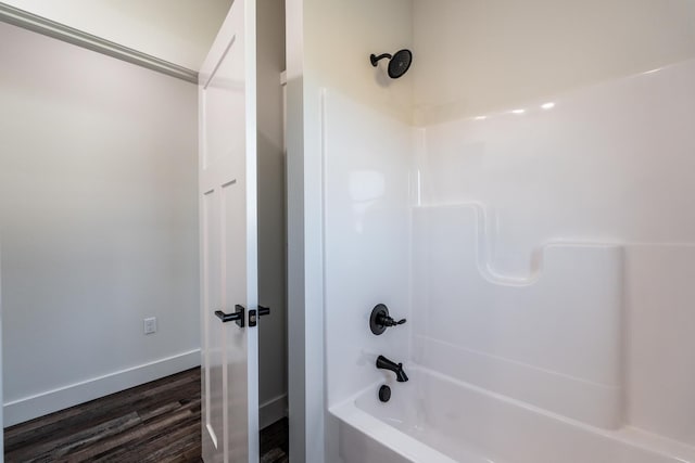 bathroom with shower / bath combination and wood-type flooring