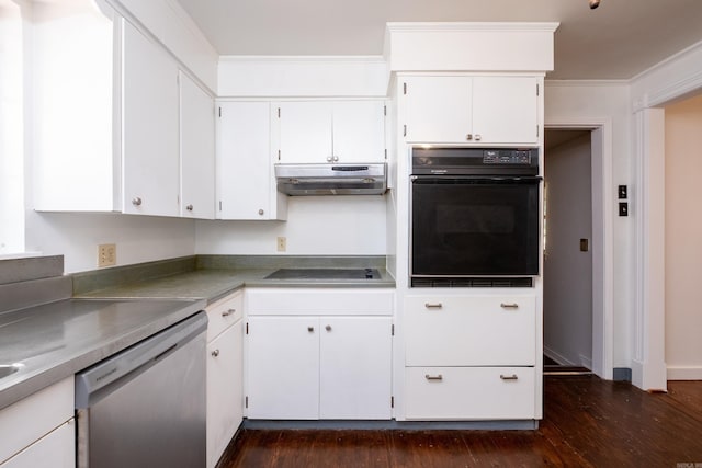 kitchen with white cabinets, dark wood finished floors, under cabinet range hood, ornamental molding, and black appliances