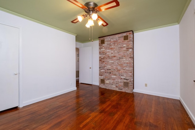 interior space with crown molding, a ceiling fan, baseboards, and wood finished floors